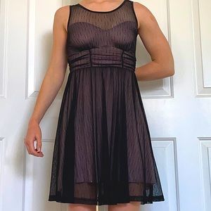 Delicate black sheath dress with pink slip
